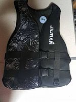 Front view of Jiuran life jacket showing pattern panel, straps, and logo