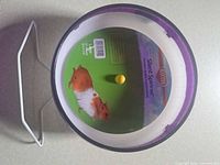 Front view showing wheel face, purple rim, cardboard insert graphics