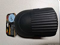 Front view of knee pad and packaging