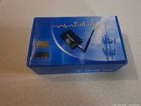 Front of blue retail box showing image of repeater and tower graphic