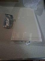 Full view of antenna with hardware beside it