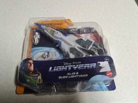 Front view of sealed blister pack showing XL-01 spaceship and Buzz Lightyear figure