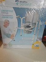 Front of sealed box showing MedPro Defense Comfort Plus commode chair
