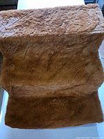Top view showing brown carpeted surface of three steps