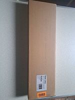 Closed brown shipping box with product label