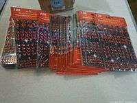 Multiple sealed packs of red heart crystal stickers displayed