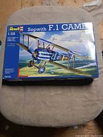 Front of box with artwork and scale information
