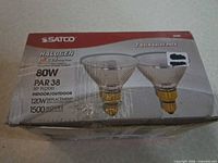 Front of box showing brand, wattage, type, beam and life rating
