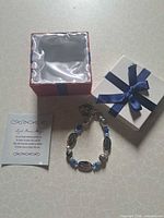 Bracelet, gift box, and card overview