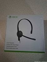 Front of retail box showing image of the single-ear Xbox chat headset