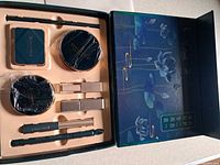 Overall boxed makeup set showing all components in foam tray and decorative outer sleeve