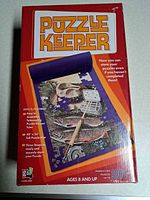 Front of red Puzzle Keeper box showing product image and specs