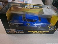 Front view of boxed Ertl American Muscle 1958 Chevy Impala Michigan State Police model