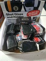Retail display box containing multiple boxed shot glass & holder units