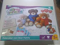 Front of boxed Out To Impress Sew-Your-Own Bear Family kit showing graphics of three finished bears and age 5+
