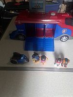 Mission Cruiser truck open with ramp, mini vehicle and four figures visible