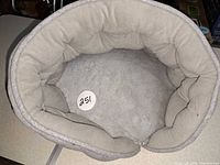 Interior view showing plush faux-fur lining and bolstered sides