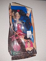 Front view of boxed Vanessa in Spain doll showing doll, outfit, accessories, and crushed packaging