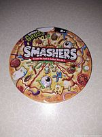 Top view of round Zuru Smashers Series Gross tin
