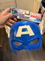 Front view of blue Captain America mask with header card