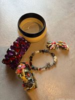 Group shot showing all bracelets and earrings