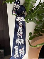 Full view of navy blue tie with Dalmatian design