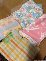 All four folded quilts visible