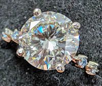 Close-up of center 3 ct lab-grown diamond in prongs