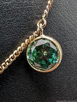 Round green fancy color lab-grown diamond bezel-set on gold chain