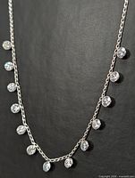 Full view of 20-inch gold chain necklace with bezel-set diamonds
