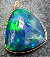 Front view of opal pendant showing color play