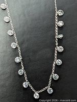Full view of necklace displaying bezel-set diamonds