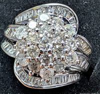 Front view of diamond cluster ring showing overall design and stone layout