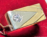 Top view showing diamond set in two-tone geometric face
