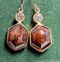 Front view of both earrings showing diamond shapes and colour