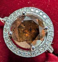 Top view showing brown centre diamond and surrounding halo of accent diamonds