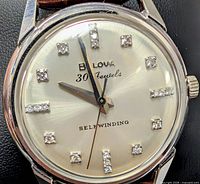 Close-up of dial showing Bulova branding, 30 Jewels text, diamond hour markers