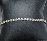 Full bracelet displayed on stand highlighting uniform diamonds