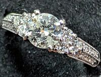 Angled view showing center diamond and side clusters