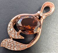 Front view of pendant showing oval tourmaline and surrounding diamonds