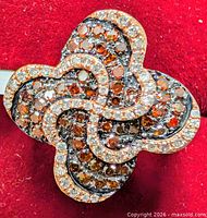 Top view of clover-shaped diamond ring showing stone arrangement and design