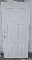 Front view of white six-panel metal-clad door