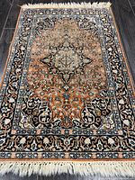 Full view of rug showing entire design and fringe