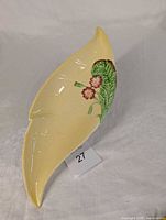 Top view showing yellow leaf shape and floral decoration