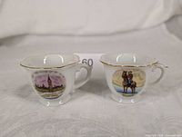 Both miniature teacups side by side showing designs and scale