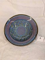 Front view of purple glazed ceramic bowl