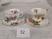 Front view of both teacups on saucers