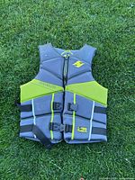 Front view of Hyperlite life jacket showing zipper, straps, colour scheme