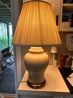 Full view of lamp with shade illuminated