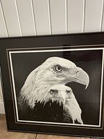 Full framed print showing two eagle heads